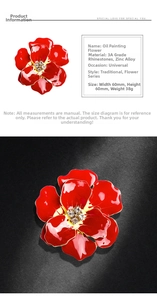 Macro detail of red enamel rose brooch with 3A rhinestones and zinc alloy finish