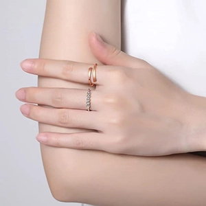 Adjustable silver spinner ring with rotating beads for anxiety relief on finger