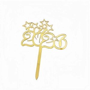 Macro shot of 2025 golden acrylic cake topper with star patterns for New Year party decor
