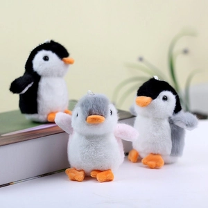 Cute plush penguin keychains for backpacks in black, white, and pink soft fabric styles