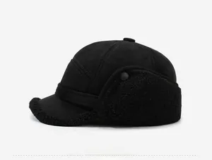 Detailed side view of black winter trapper hat with soft faux fur lining and metal sports badge