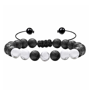 Close-up of adjustable woven bracelet with black lava stone and white turquoise beads