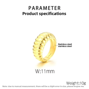 Detail view of 11mm wide stainless steel gold ribbed ring with textured surface details