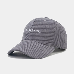 Detail of the high-quality dark grey corduroy fabric and white baba embroidery on baseball cap