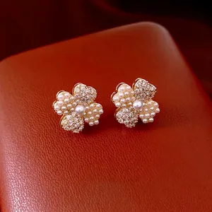 14K gold plated clover flower stud earrings with white pearls and sparkling rhinestones