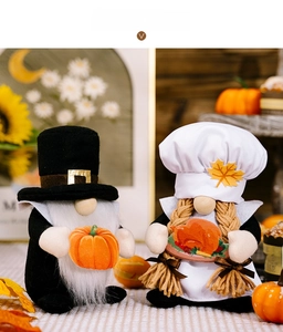 Macro detail of Thanksgiving gnomes with chef hats holding a pumpkin and turkey