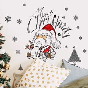 Detail of Christmas wall sticker with Santa on reindeer and Merry Christmas text decor