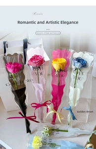 Close-up of single rose bouquets in colorful wrappers with LOVE YOU lettering
