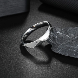 4mm faceted frosted geometric stainless steel ring for couples on a textured stone base