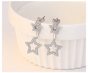 Macro shot of S925 sterling silver double star earrings with shimmering cubic zirconia