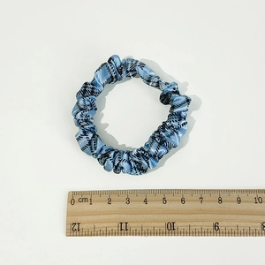 Blue houndstooth scrunchie hair tie for women shown with wood ruler measurement