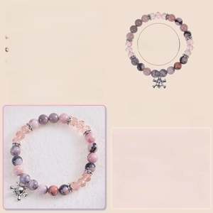 Detailed view of 8mm natural stone beads with elastic rope and skull charm punk bracelet