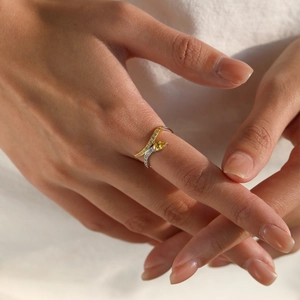 Elegant S925 silver snake ring with a pear-cut yellow gemstone and crystal pavé band