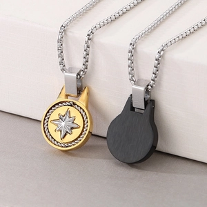 Detail of two-tone hexagram compass pendant with silver box chain on premium box