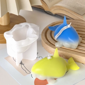 Macro detail of shark silicone candle mold with finished gradient animal wax figures
