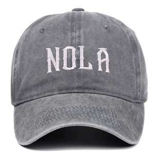 Retro washed dark grey baseball cap with pink NOLA embroidery in a classic 6-panel style
