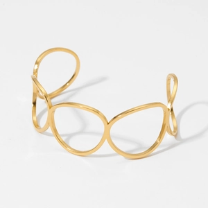 Gold stainless steel oval open bangle featuring a geometric hollow multi-ring structure