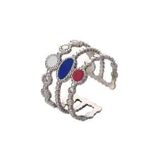 Detail showing multilayer wave design silver ring with red blue and white enamel inlay