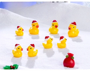Miniature resin Christmas ducks with red hats on snowy landscape for DIY holiday decor