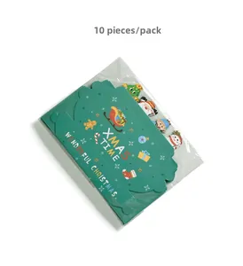Detail of 10-pack green Christmas gift boxes with Santa and gingerbread man illustrations