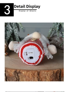 Close-up of a Christmas gnome doll base showing the battery box and power toggle switch
