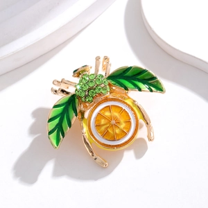Broche abeille dorée avec ventre en émail citron et ailes en cristal vert brillant