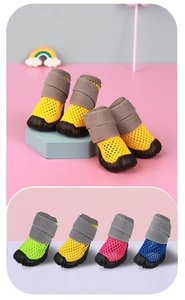 Detail of breathable mesh dog sandals with non-slip rubber soles in multiple vibrant colors