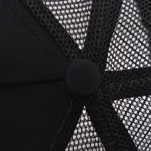 Detail of black baseball cap showing the top button, reinforced stitching and breathable mesh