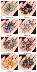 Detail view of assorted natural crystal mushroom pendants with silver clips in eight styles
