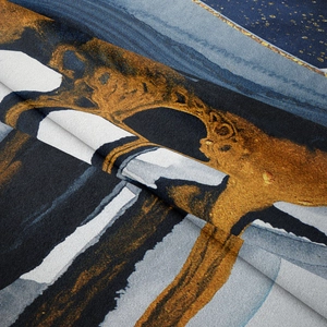 Close-up of soft mountain tapestry fabric with abstract blue and gold fluid art print