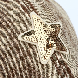 Denim baseball cap with golden sequin star embroidery and thick textured fabric