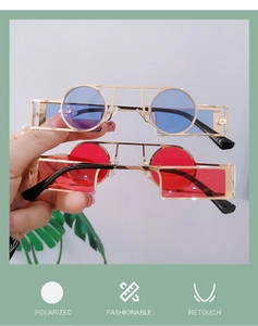 Close-up of steampunk sunglasses with gold metal frames and polarized colored lenses