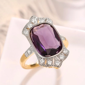 Macro shot of vintage rectangular purple amethyst ring with gold and silver dual-tone finish