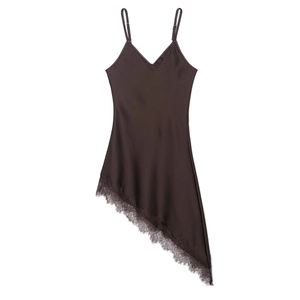 Detail of dark brown satin dress showing asymmetric lace hem and eyelash lace texture