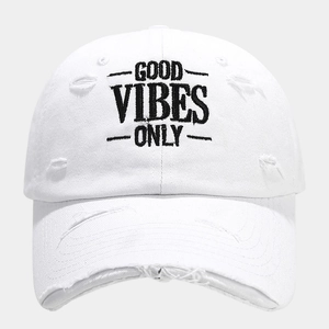 Detail of distressed white baseball cap featuring Good Vibes Only embroidery design
