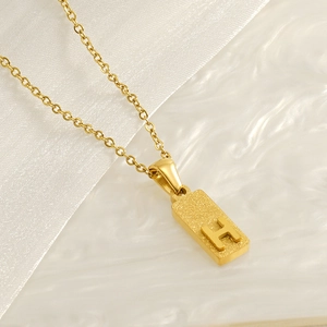 Gold stainless steel rectangle necklace with frosted texture and letter H pendant