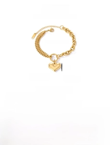 Close-up of golden stainless steel double-layered chain bracelet with heart charm and OT buckle