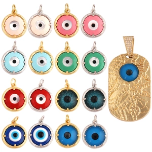 Colorful evil eye heart and round pendants in gold and silver finish on white background