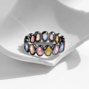 S925 Sterling Silver Rainbow Ring with colorful oval gemstones on artistic ceramic base