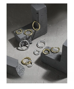Macro detail of various sizes gold and silver S925 sterling silver hoop earrings