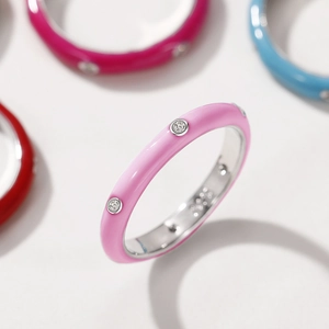 Macro shot of S925 sterling silver ring with pink enamel finish and zircon stone detail