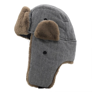 Winter aviator hat for men with black and white herringbone pattern and brown faux fur lining