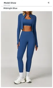 Three-piece yoga set in midnight blue with jacket, sports bra, and high-waisted leggings