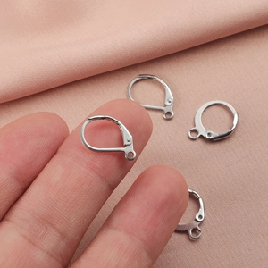 Silver stainless steel leverback earring hooks for DIY jewelry making on pink fabric
