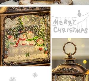 Detail of bronze Christmas lantern with snowman family and sparkling water globe effect