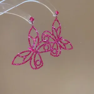 Exquisite silver needle butterfly earrings featuring rose pink cubic zirconia in luxury style