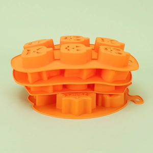 6-cavity orange silicone Halloween mold with pumpkin and spider web patterns for chocolate