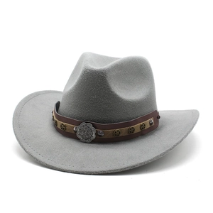 Close-up of grey felt cowboy hat with brown studded leather band and metal rivets