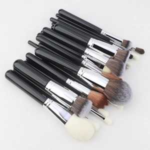 Close-up of 30pcs professional makeup brushes with black handles and soft synthetic bristles
