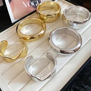 Minimalist gold and silver polished open cuff bracelets with elegant mirror finish